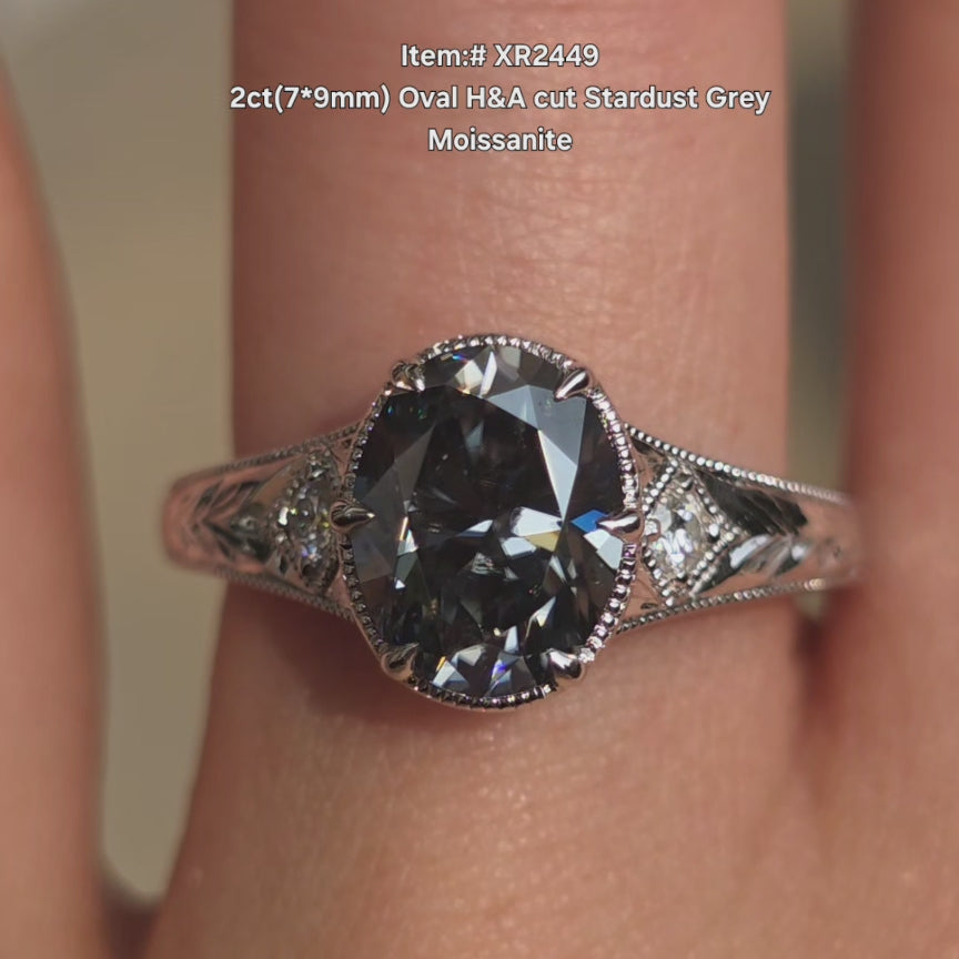 DovEggs oval H&A cut stardust grey color moissanite ring sparkling in sunlight video.