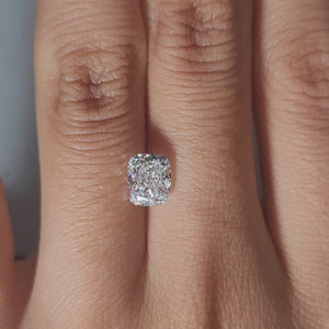Finger-worn video of 1.53ct cushion diamond in ambient indoor light"