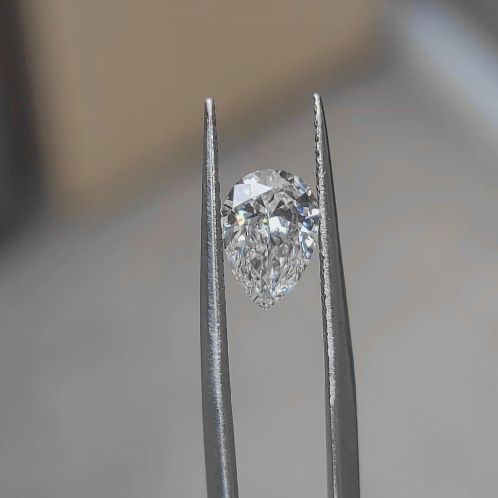 "Sunlight video showing 1.239ct pear cut diamond's elegant sparkle"
