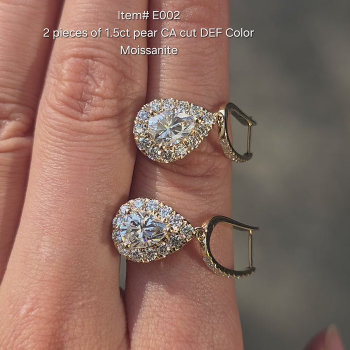 Pear crown arrow cut moissanite earrings sparkling in sunlight video