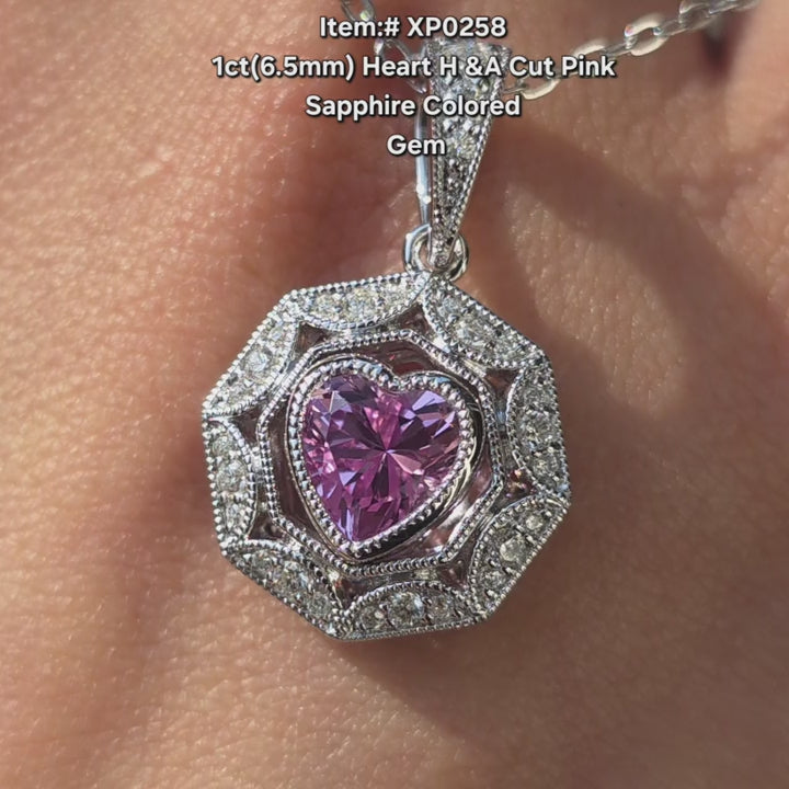 Heart shape pink sapphire pendant sparkling in sunlight video.
