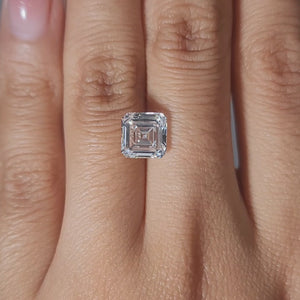 Finger-worn video of 2.54ct Asscher diamond in warm glow