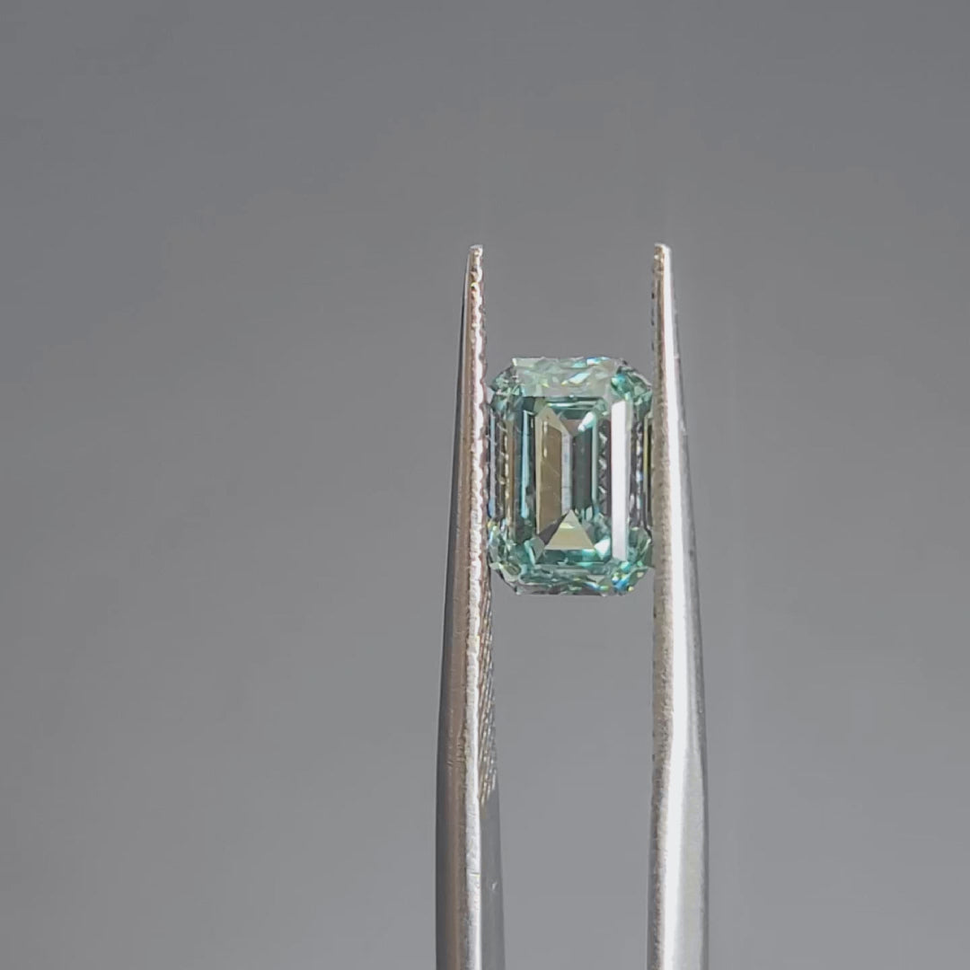 Sunlight video revealing 2.064ct emerald cut's hall-of-mirrors effect and blue tone