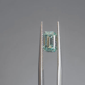 Sunlight video revealing 2.064ct emerald cut's hall-of-mirrors effect and blue tone