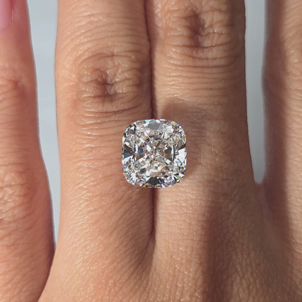 Best place to buy lab grown diamonds: view a 5.13ct cushion brilliant cut in hand, indoors.