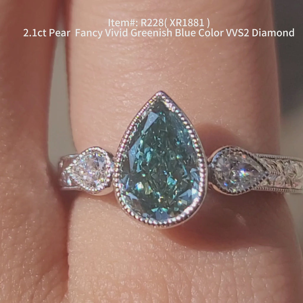 2.1ct Pear fancy vivid blue diamond shinning under the sunlight.