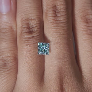 Hand-display video of 1.502ct blue princess diamond in warm glow