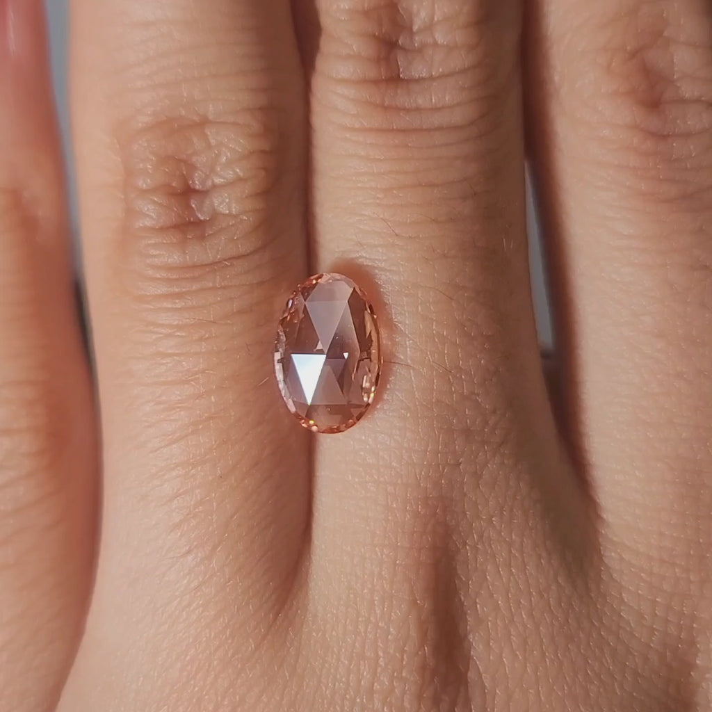 "Finger modeling video of 1.68ct pink oval rose cut in evening light"