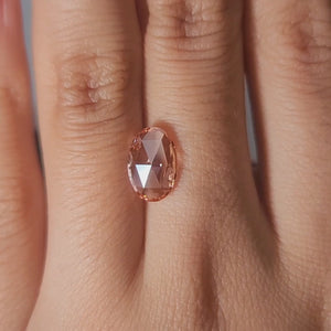 "Finger modeling video of 1.68ct pink oval rose cut in evening light"