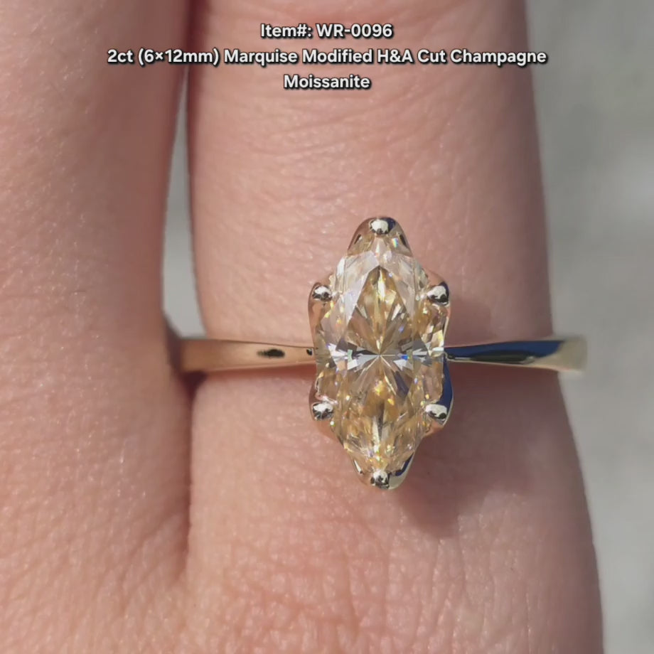 DovEggs H&A cut Champagne Marquise Modified moissanite ring sparkling in sunlight video.