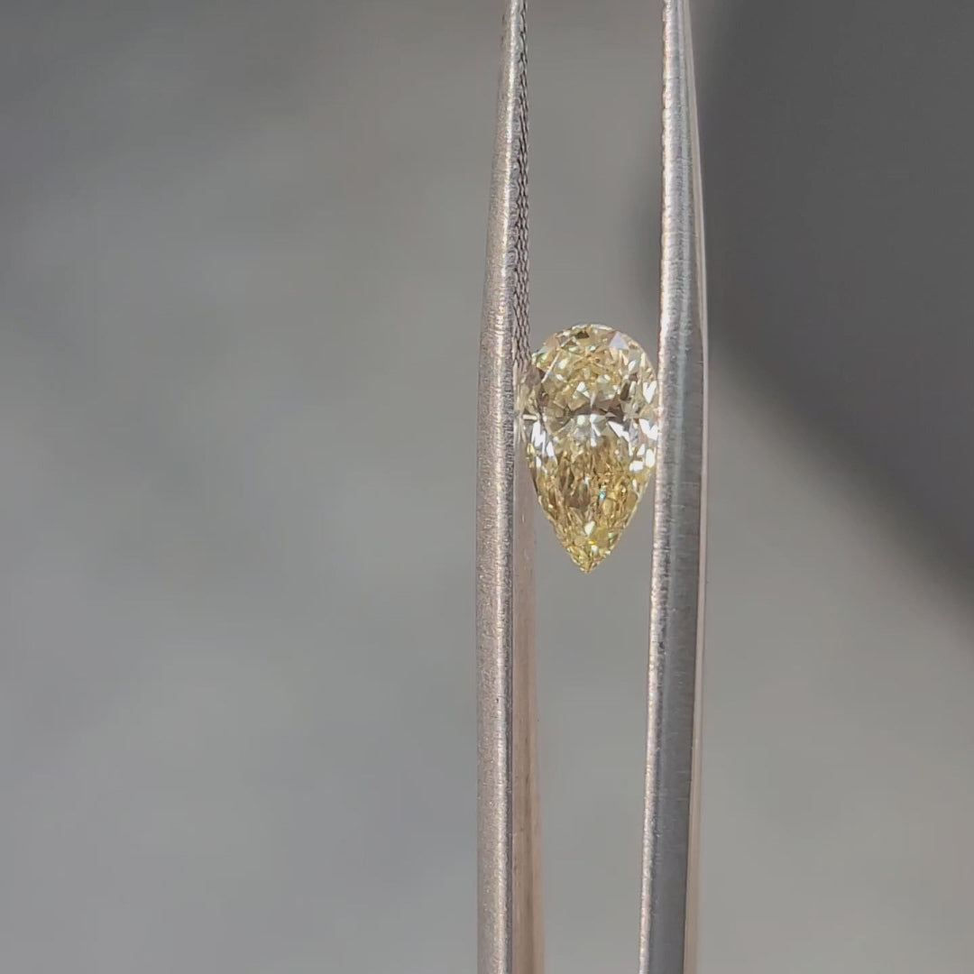1.67ct pear cut vivid yellow diamond video showing brilliant sparkle in sunlight