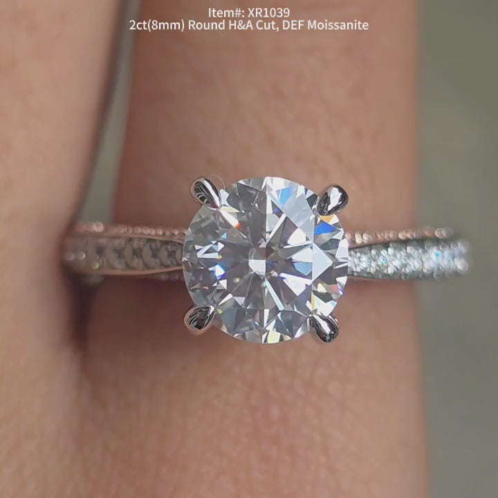DovEggs DEF color H&A round moissanite engagement ring sparkling in sunlight video