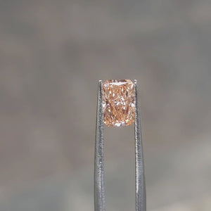Sunlight video of 1.52ct radiant cut's vibrant pink reflections