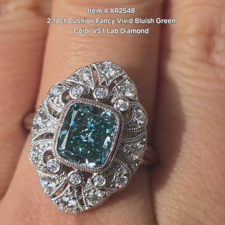 DovEggs 2.18ct Cushion Fancy Bluish Green Lab Diamond bezel ring sparkling in sunlight video.