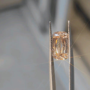 4.55ct modified cushion fancy orange diamond in natural light, showing vibrant color