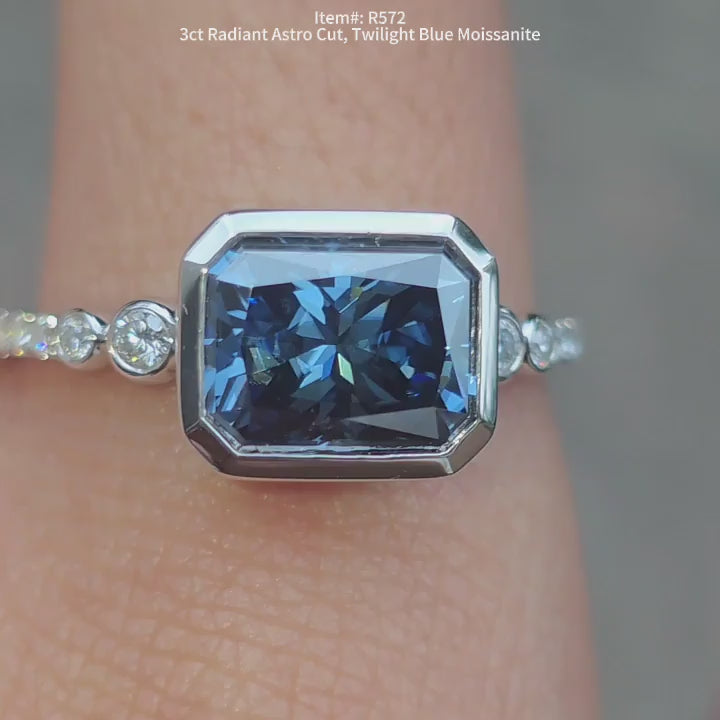 DovEggs Astro Twilight blue radiant moissanite ring sparkling in sunlight video