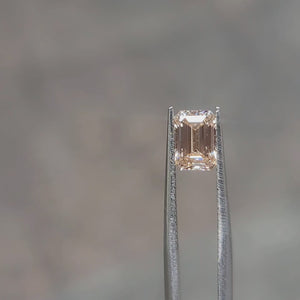 1.38ct Emerald lab diamond’s delicate orange sparkle outdoors