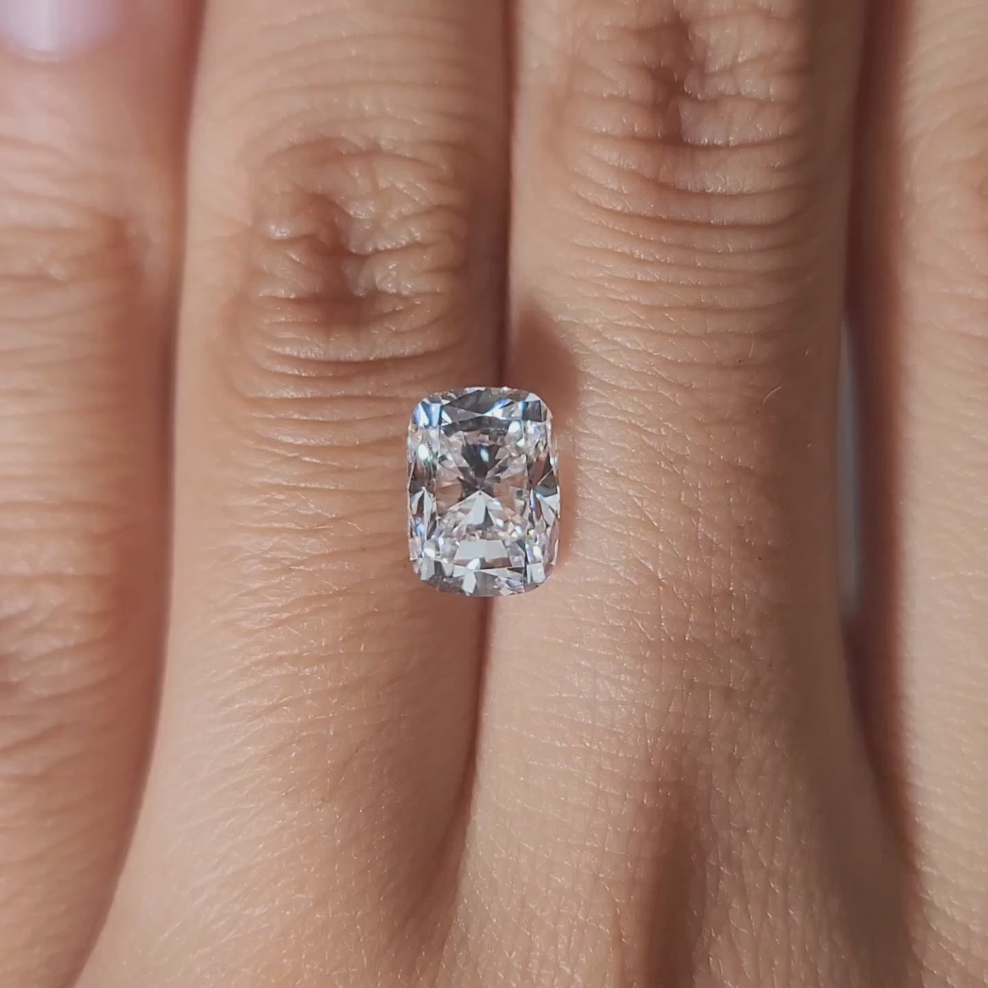 Three-stone setting video of 2.57ct cushion diamond