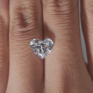 Close-up hand video showcasing 2.378ct heart diamond in soft indoor light