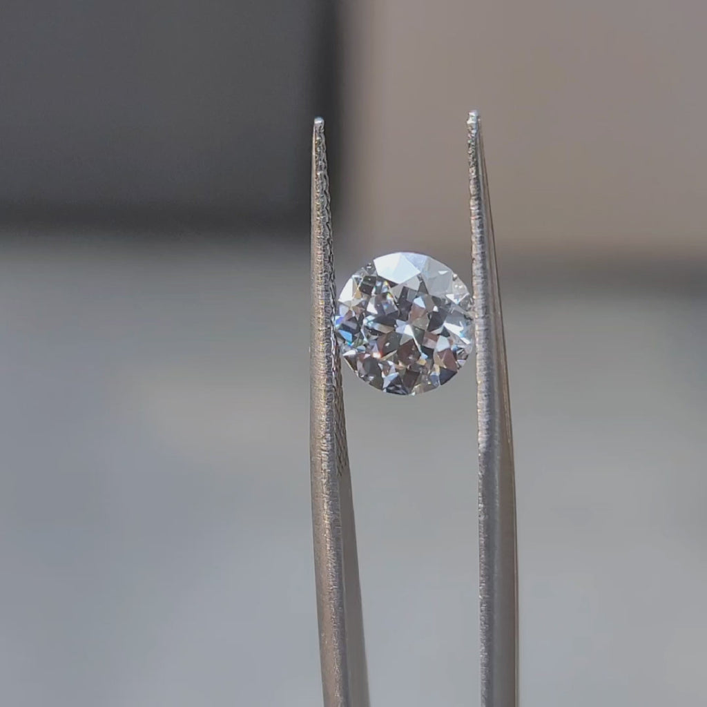 1.660ct round excellent cut diamond (D/VVS2) in natural light, displaying ideal proportions
