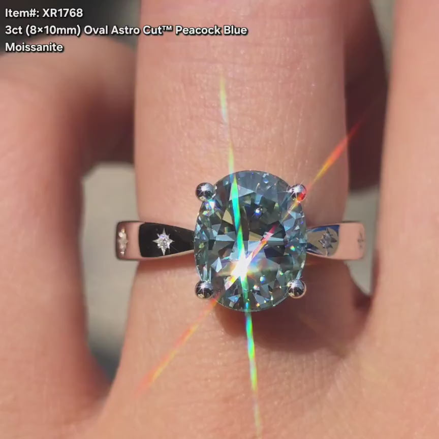 DovEggs oval peacock blue moissanite star loop engagement ring video in sunlight