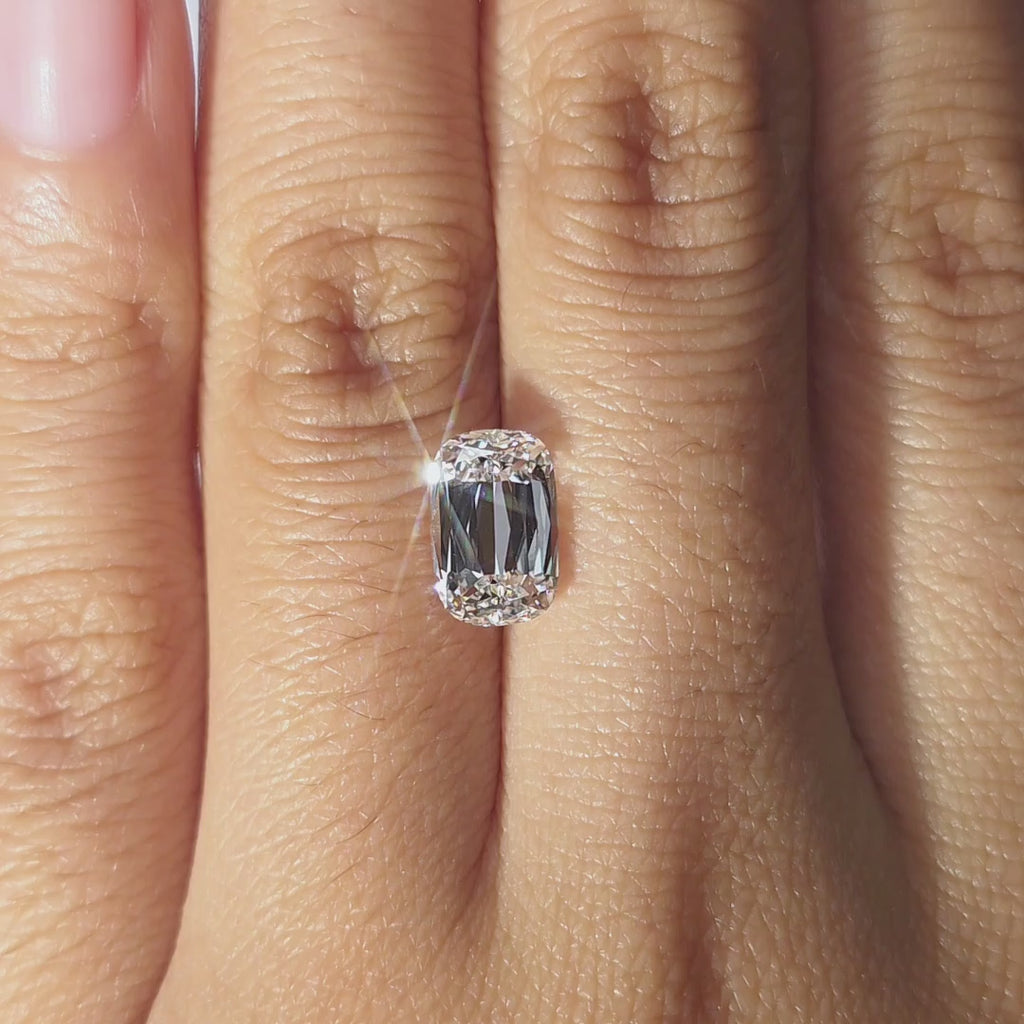 Lab diamond 2.54ct modified elongated cushion D color VVS1 by DovEggs hand modeled in warm indoor light.