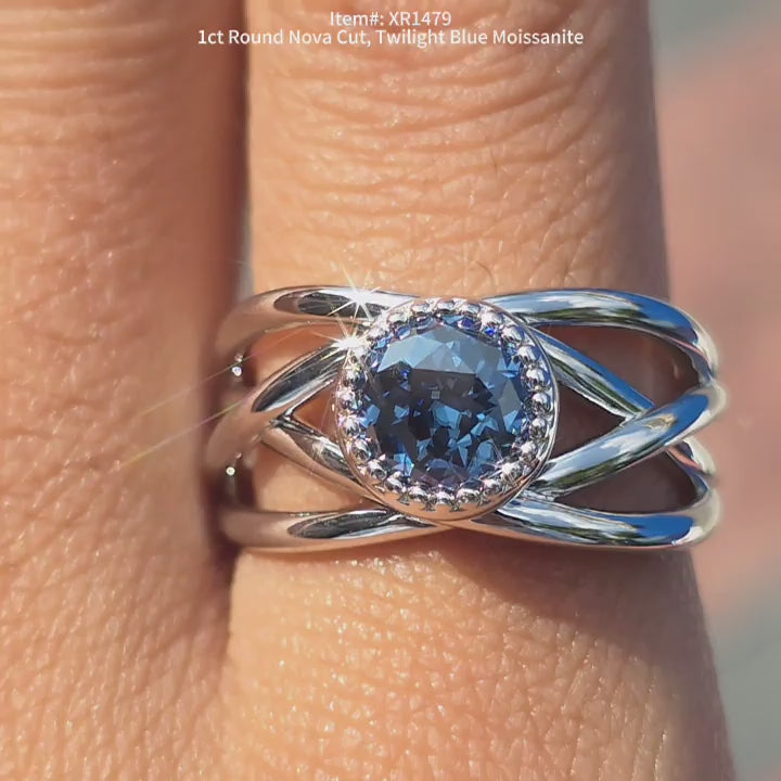DovEggs Nova cut twlight blue moissanite ring sparkling in sunlight video