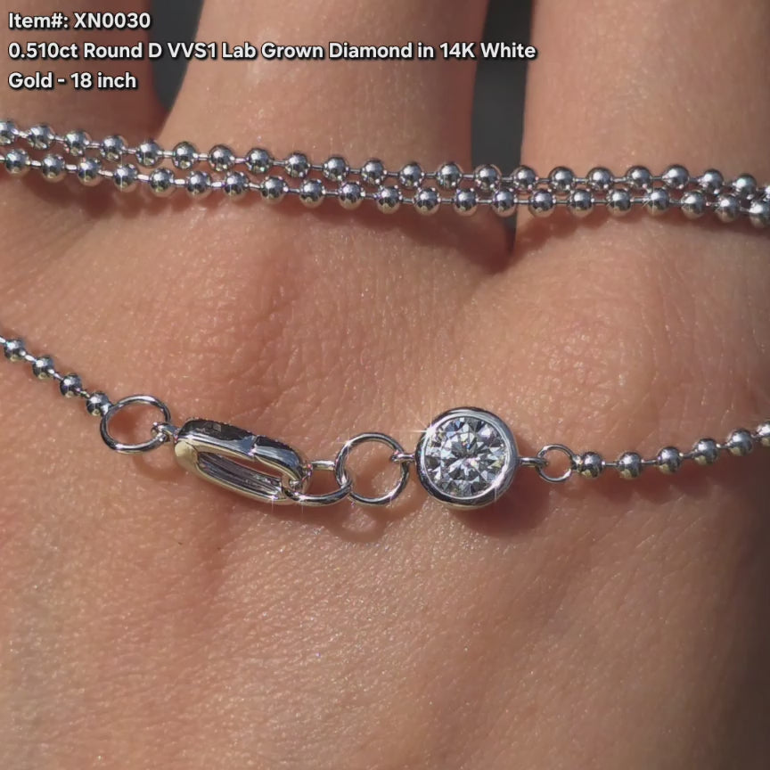 DovEggs round lab diamond pendant necklace sparkling in sunlight video