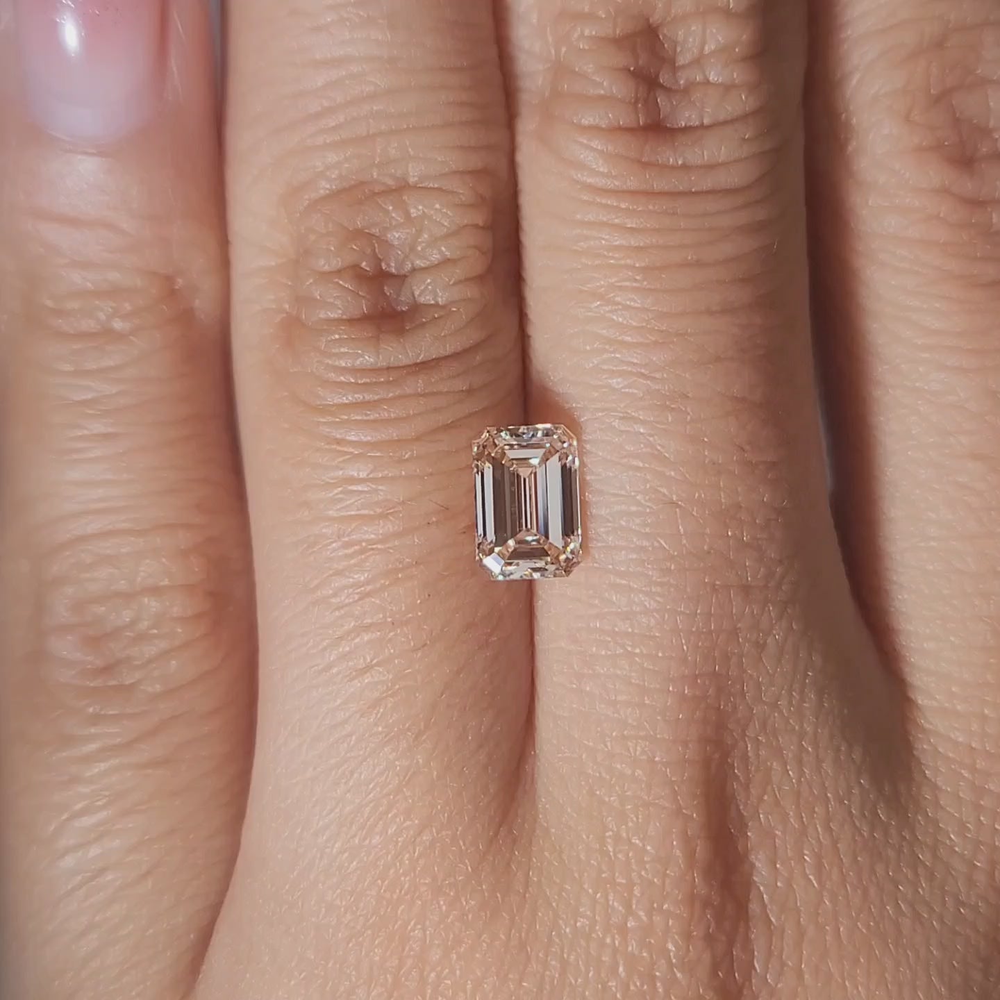 1.38ct Emerald light orange diamond in soft candlelight