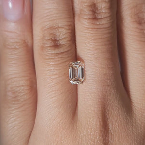 1.38ct Emerald light orange diamond in soft candlelight
