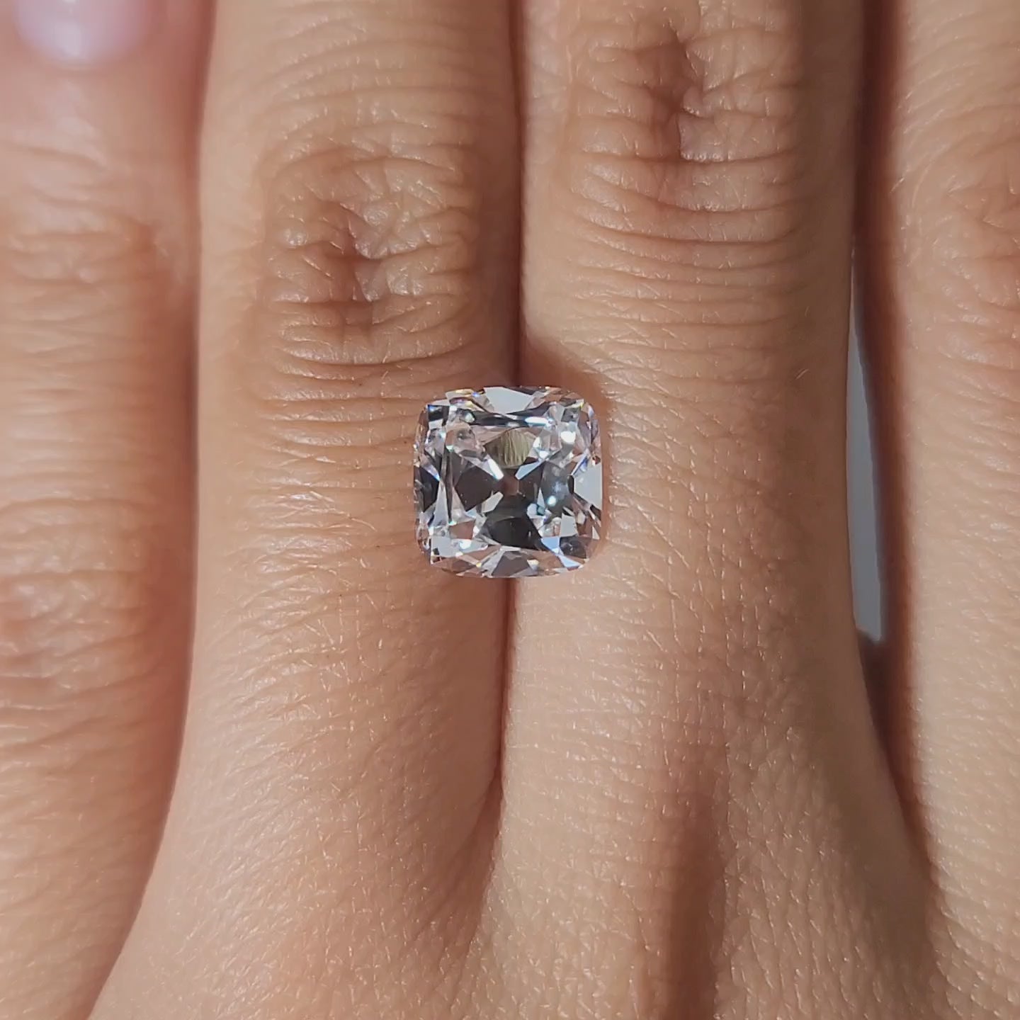 2.56ct Cushion D color VVS1 diamond in warm lighting