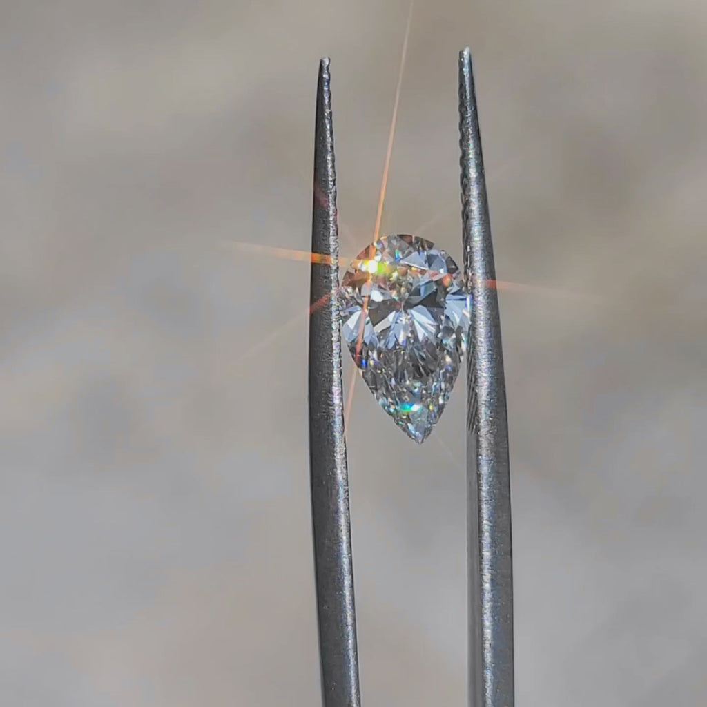 Outdoor video capturing 1.79ct pear F color VS1 diamond's delicate sparkle
