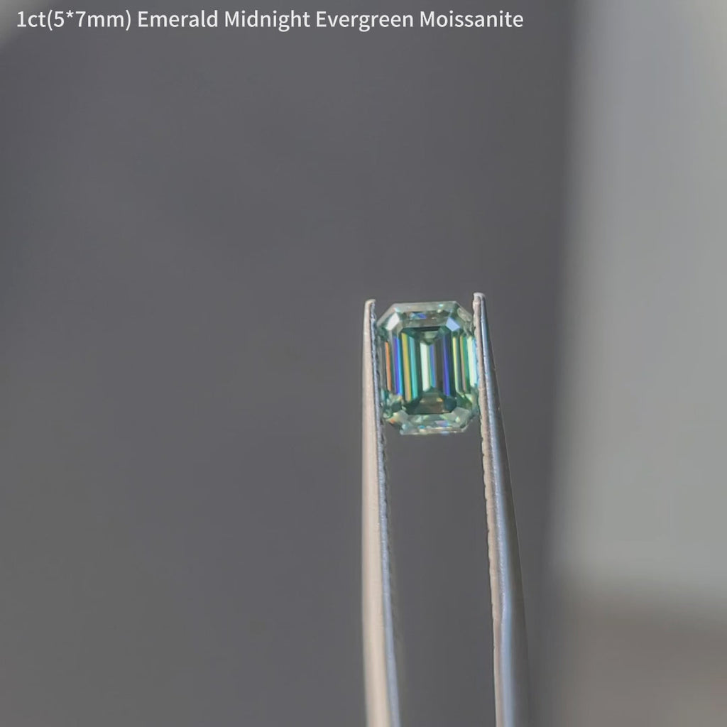 DovEggs Emerald midnight evergreen accident color moissanite in sunlight and outdoor lighting