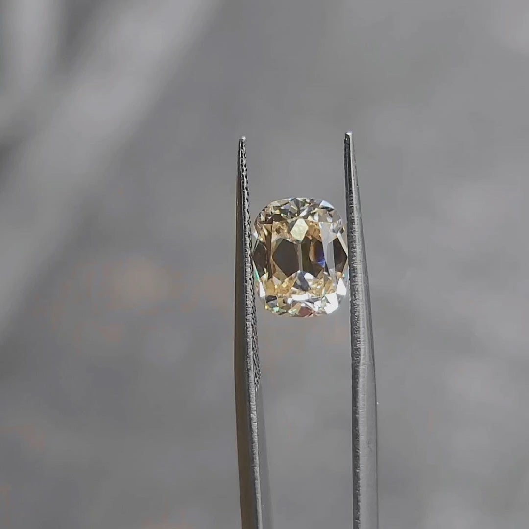 2.73ct cushion cut fancy orange diamond in natural light, showing vintage-inspired faceting