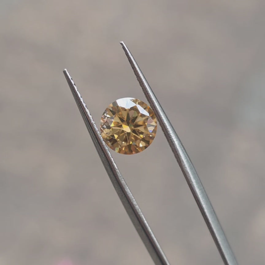 elongated cushion deep champagne loose moissanite under outdoor lighting