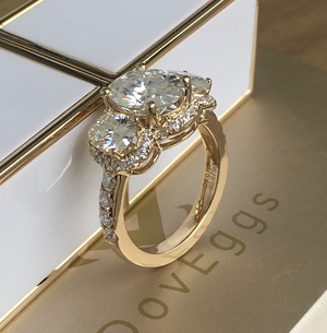 Doveggs oval three-stone halo moissanite engagement ring