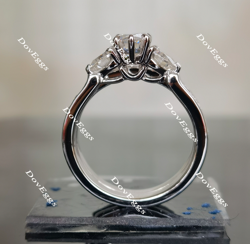 The Kiera Alaina pear half eternity channel set three stones moissanite engagement ring