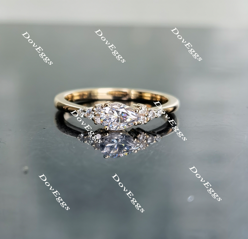 Doveggs pear side-stone moissanite engagement ring
