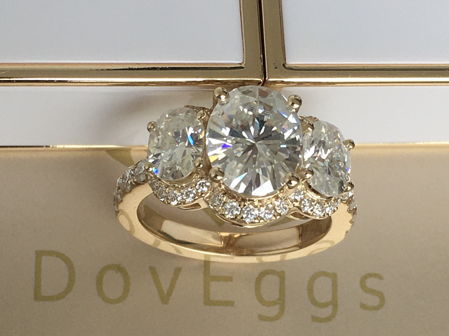 Doveggs oval three-stone halo moissanite engagement ring