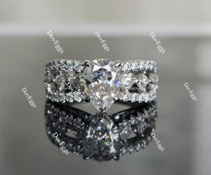 The Mikinzy pear split shank half eternity pave moissanite engagement ring