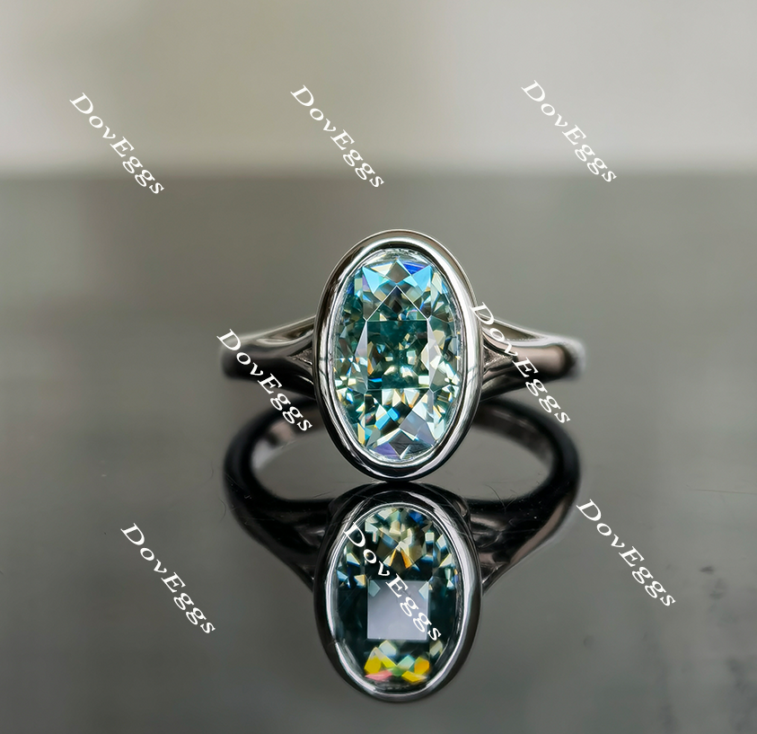 Oval nova cut solitaire bezel peacock blue moissanite engagement ring