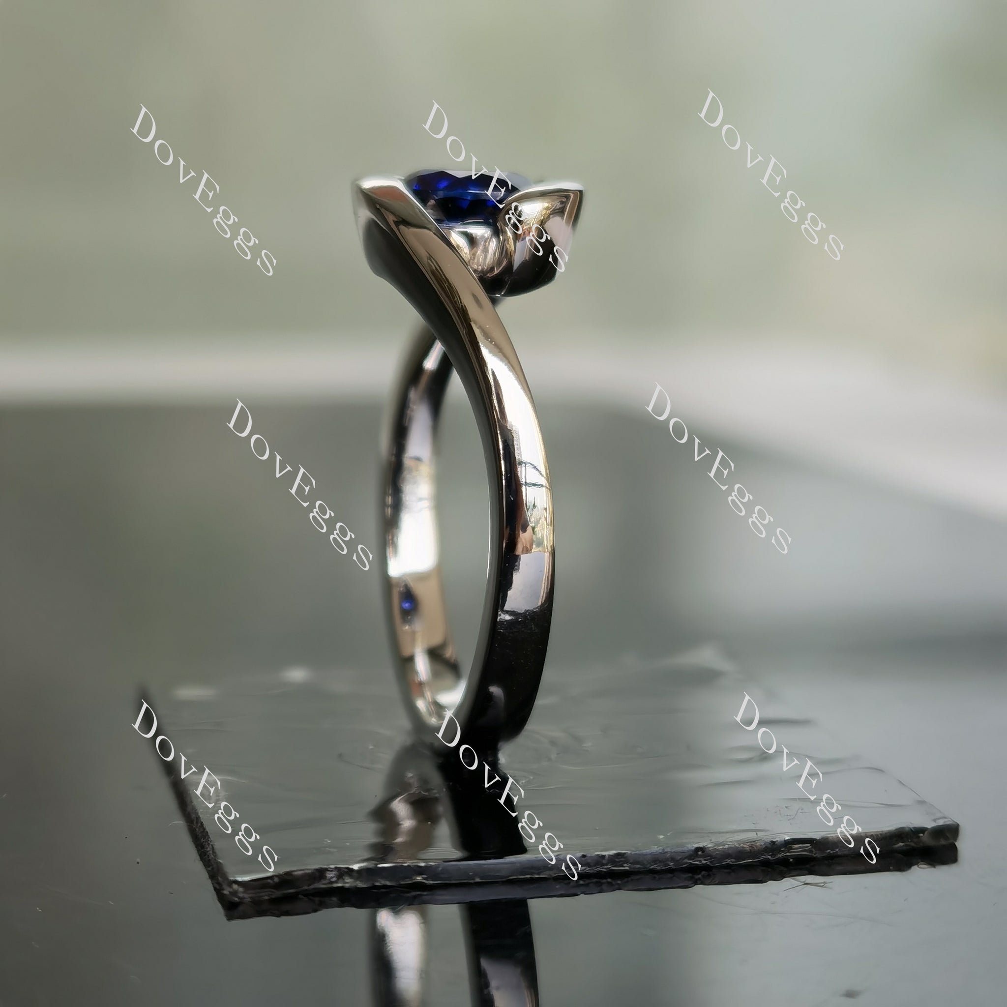 Ocean Wave round solitaire intense royal blue sapphire colored gem engagement ring