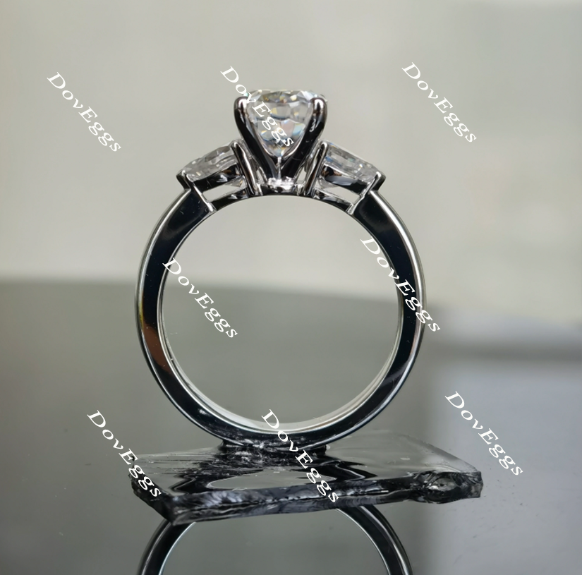 DovEggs elongated oval three-stone moissanite engagement ring