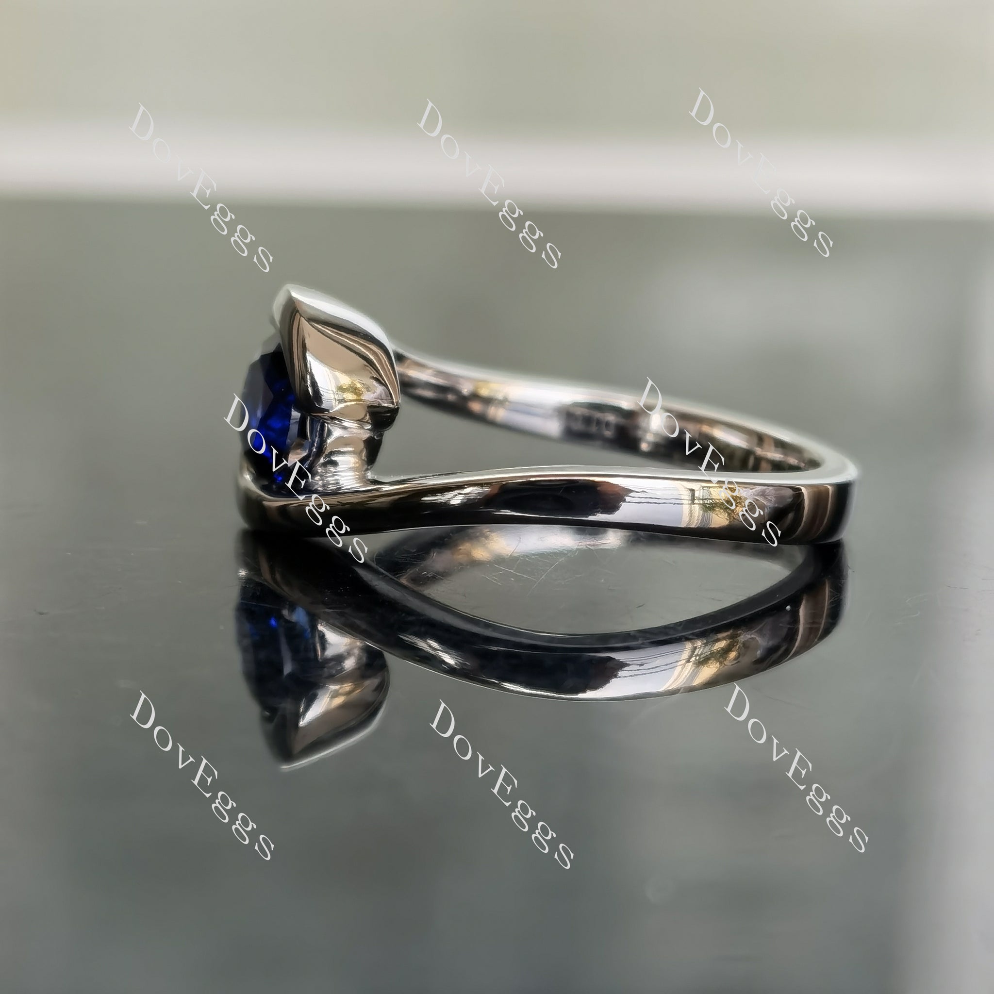 Ocean Wave round solitaire intense royal blue sapphire colored gem engagement ring